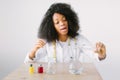 Lab assistant testing water quality. Portrait of a young beautiful African American girl researcher chemistry student Royalty Free Stock Photo