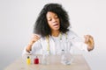 Lab assistant testing water quality. Portrait of a young beautiful African American girl researcher chemistry student Royalty Free Stock Photo