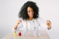 Lab assistant testing water quality. Portrait of a young beautiful African American girl researcher chemistry student Royalty Free Stock Photo