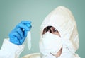 Lab scientist in safety suit With test tube Royalty Free Stock Photo