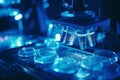 Lab technician analyzing biomaterial samples under microscope, observing cell structures Royalty Free Stock Photo