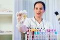 Lab technician assistant analyzing urin sample at laboratory. Royalty Free Stock Photo