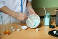 the chemist mixes the powder in a mortar by pestle. Royalty Free Stock Photo