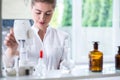 Lab technician doing chemistry experiment