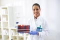 Lab technician holding samples with tubes Royalty Free Stock Photo