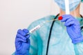 Lab technician holding swab collection kit,Coronavirus COVID-19 specimen collecting equipment,DNA nasal and oral swabbing for PCR Royalty Free Stock Photo