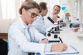 Lab technician taking notes Royalty Free Stock Photo