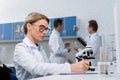 Lab technician taking notes Royalty Free Stock Photo