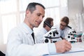 Lab technician taking notes Royalty Free Stock Photo