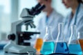 Lab technicians work in laboratory using microscope, medical equipment. Flasks contain chemical liquid. Science researches, Royalty Free Stock Photo