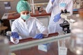 Lab worker with automatic pipette putting sample