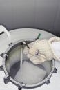 Lab Worker Holding Rack In Nitrogen Tank