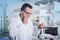 Lab worker observing test tube with mold at the laboratory