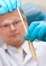 Lab worker testing liquid Royalty Free Stock Photo