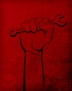 Labour Day red textured background with black hand spanner Royalty Free Stock Photo