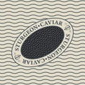 Label for black sturgeon caviar in an oval frame