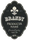 Label for brandy with fleur de lis in curly frame