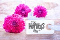 Label With Calligraphy Happy Mothers Day. Three Puprle Flower Blossoms