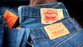 Label of the famous Levi`s Strauss jeans on trousers for sale in a market