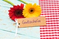 Label with german word, Gutschein, means voucher or coupon with beautiful flowers