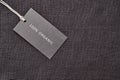 Label on linen fabric background. 100 percent organic materia