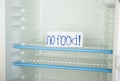 Label no food in an empty refrigerator