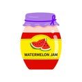 Label with piece watermelon on a jar of confiture. closeup Glass jar with watermelon jam.