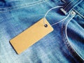 Label price tag mockup on blue jeans. Royalty Free Stock Photo