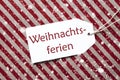 Label On Red Paper, Snowflakes, Weihnachtsferien Means Christmas Break