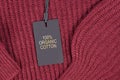 Label saying `100% organic cotton` attached to environmental friendly produced pullover