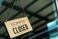 Label `Sorry we are closed please come back again` notice sign wood Royalty Free Stock Photo