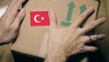 Labeling carton with the Turkish flag sticker. Import or export in Turkey Royalty Free Stock Photo