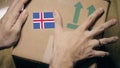Labeling carton with the Icelandic flag sticker. Import or export in Iceland Royalty Free Stock Photo