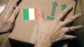 Labeling carton with the Irish flag sticker. Import or export in Ireland Royalty Free Stock Photo