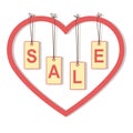 Labels with letters ÃÂ«SALEÃÂ» hanging on ropes inside the heart.