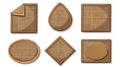 Labels made of brown canvas material with stitches isolated on white. Jute cloth patches with burlap fabric texture.