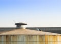 Laber welding on rooftop of big store tank. Royalty Free Stock Photo