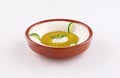 Labneh bowl on white background with cucumber