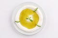 Labneh dish with olive oil with cucumber top view