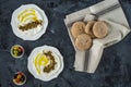 Labneh labaneh middle eastern soft white goat`s milk cheese with olive oil ,olives , za`atar , lemon, with pita bread over blac Royalty Free Stock Photo