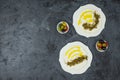 Labneh labaneh middle eastern soft white goat`s milk cheese with olive oil ,olives , za`atar , lemon, with pita bread over blac Royalty Free Stock Photo