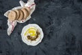 Labneh labaneh middle eastern soft white goat`s milk cheese with olive oil ,olives , za`atar , lemon, with pita bread over blac Royalty Free Stock Photo