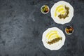 Labneh labaneh middle eastern soft white goat`s milk cheese with olive oil ,olives , za`atar , lemon, with pita bread over blac Royalty Free Stock Photo