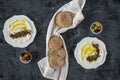 Labneh labaneh middle eastern soft white goat`s milk cheese with olive oil ,olives , za`atar , lemon, with pita bread over blac Royalty Free Stock Photo
