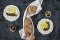 Labneh labaneh middle eastern soft white goat`s milk cheese with olive oil ,olives , za`atar , lemon, with woman hand holding o Royalty Free Stock Photo