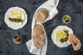 labneh labaneh middle eastern soft white goat`s milk cheese with olive oil ,olives , za`atar , lemon, with woman hand holding o Royalty Free Stock Photo