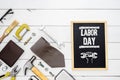 Labor day background concept. Flat lay of construction blue collar handy tools and white collar's accessories over wooden Royalty Free Stock Photo