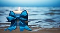 Labor Day Candle Gift: Blue Candle With Ocean Blue Bow On Beach Background