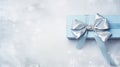 Labor Day Gift: Blue Gift Box With Bow On Snowy Background Royalty Free Stock Photo