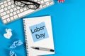 Labor Day - message on blue work place background. Labour day celebrated at May 1. Spring time